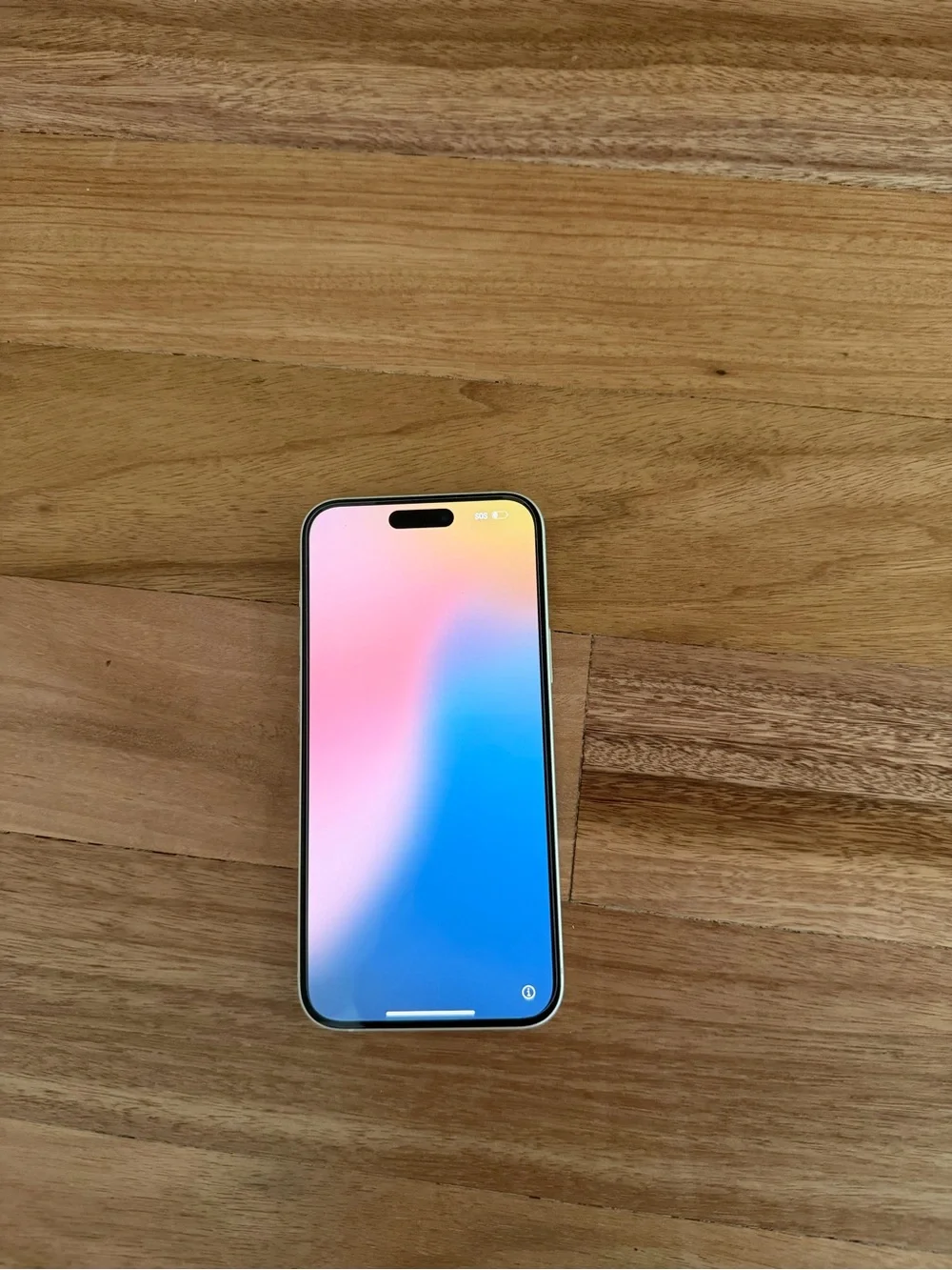Apple iPhone with Black Frame and Multicolor Gradient Screen